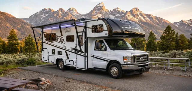 RV parked near mountain scenery before a trip